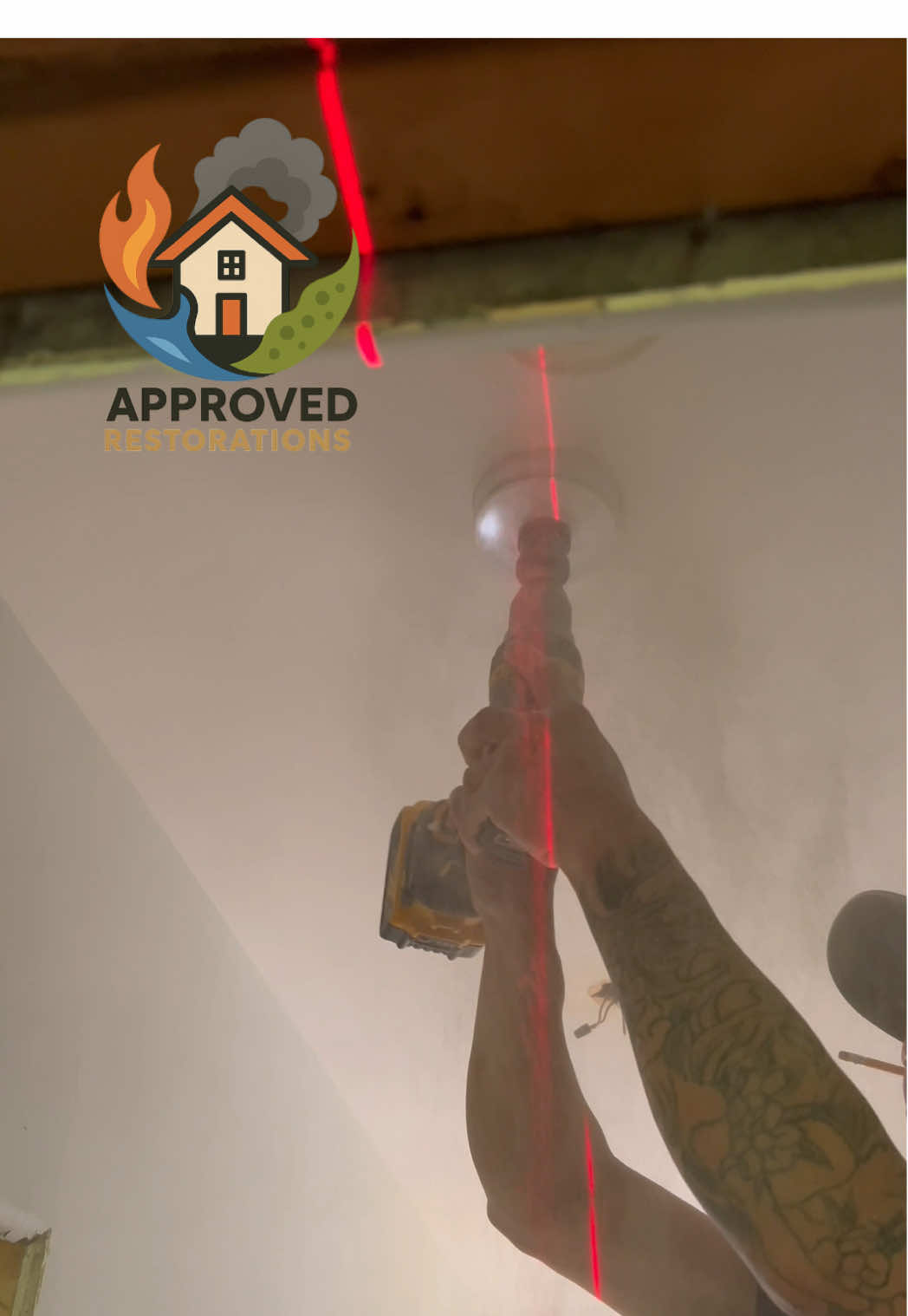 To keep everything perfectly aligned during this Newmarket upper-floor renovation, our crew shoots a laser level from the bare subfloor straight across the ceiling, guiding our hole saw as we cut fresh drywall openings for recessed lighting and drop the new electrical wiring down before finishing the rebuild.
