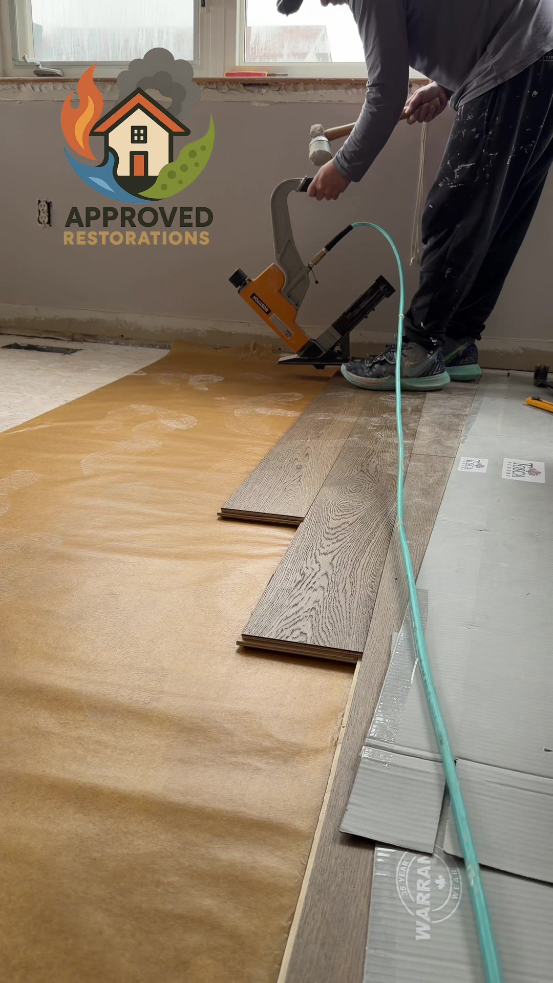Following a severe water damage incident at this Richmond Hill home, our crew is pushing through the reconstruction phase, using a pneumatic nailer to lay fresh hardwood flooring over new underlayment across the upper level before we tackle the baseboards and bring this property back to pre-loss condition.