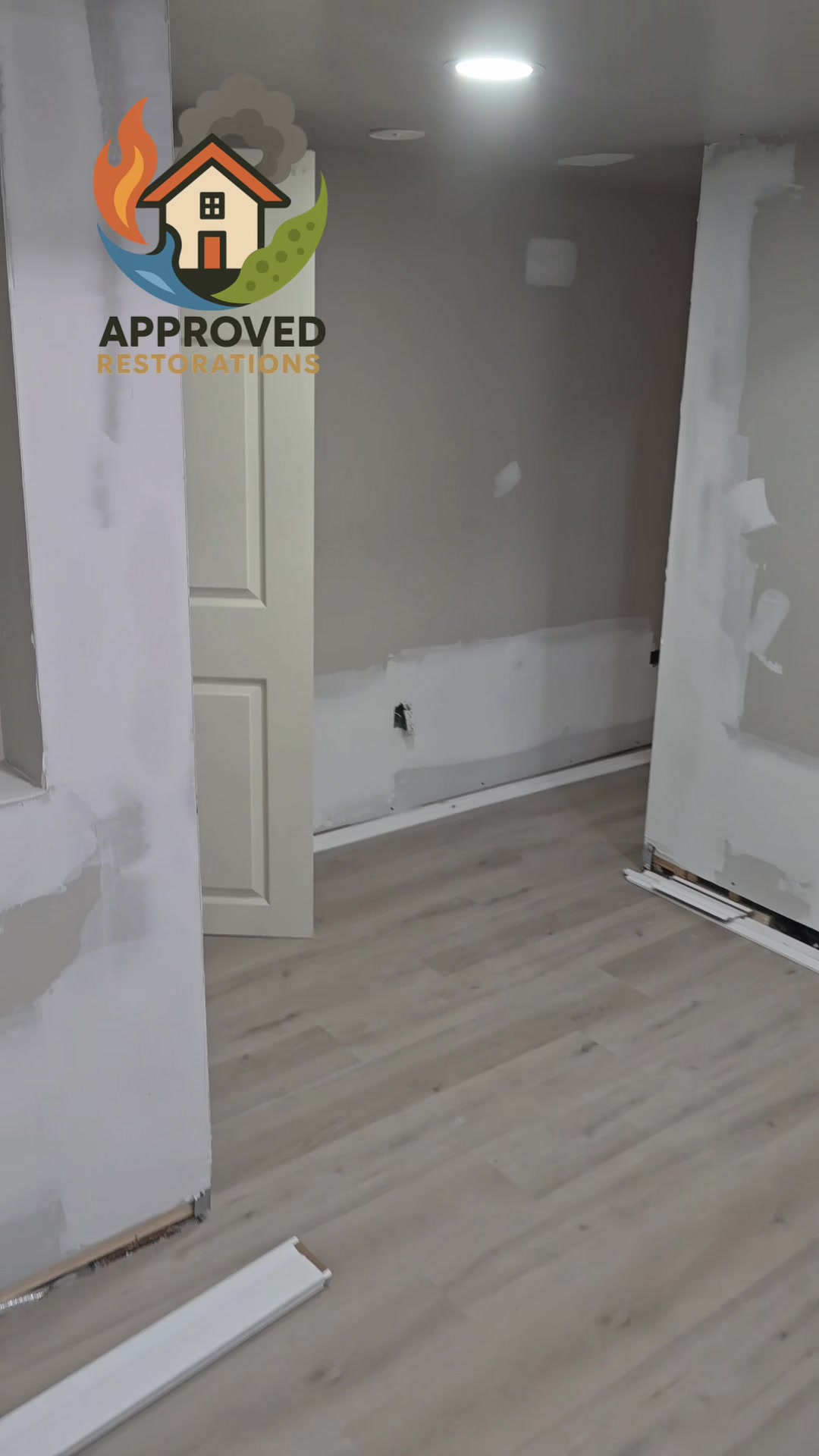 Deep into the reconstruction phase of an Ajax water damage insurance claim, our crew has already laid fresh laminate flooring and fully mudded the replacement drywall—now we just need to nail in the scattered baseboards and roll a finish coat of paint to get this bedroom completely restored.