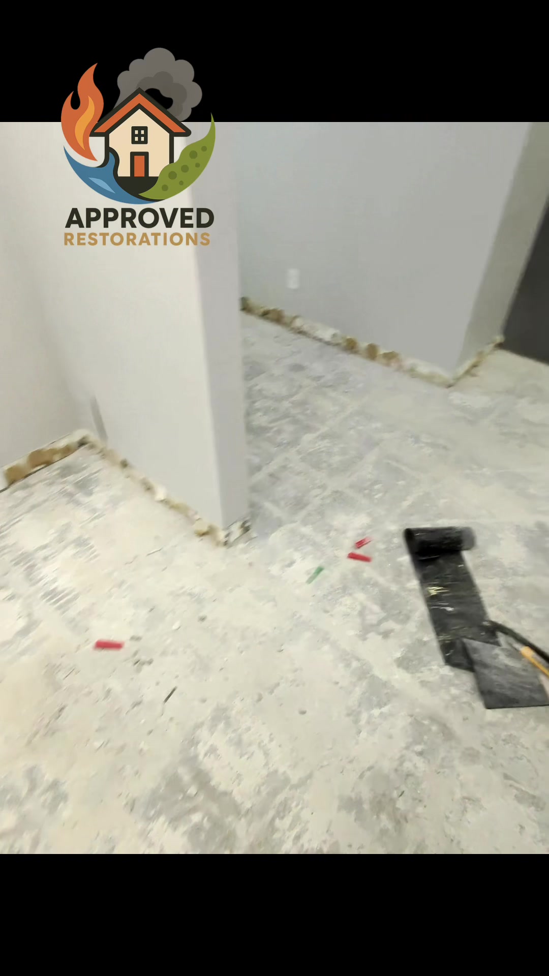 With the major demolition phase of this water-damaged condo officially complete, our crew is tackling the final cleanup, sweeping the last of the debris past the freshly flood-cut walls and chipping away residual flooring along the raised platform to prep the bare concrete for a full reconstruction.