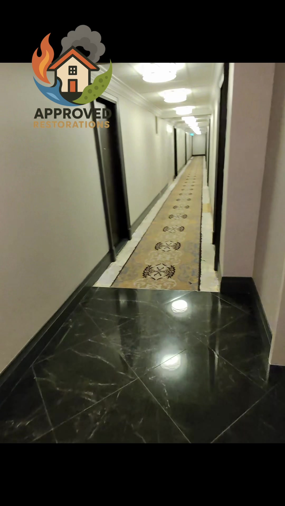 A persistent shower leak sent water crashing through the ceiling and spreading across the floor, so our team is heading down this long corridor to inspect the damage, trace the moisture path beneath the high-end tile and runners, and build a full extraction plan before the water wicks into the surrounding drywall.