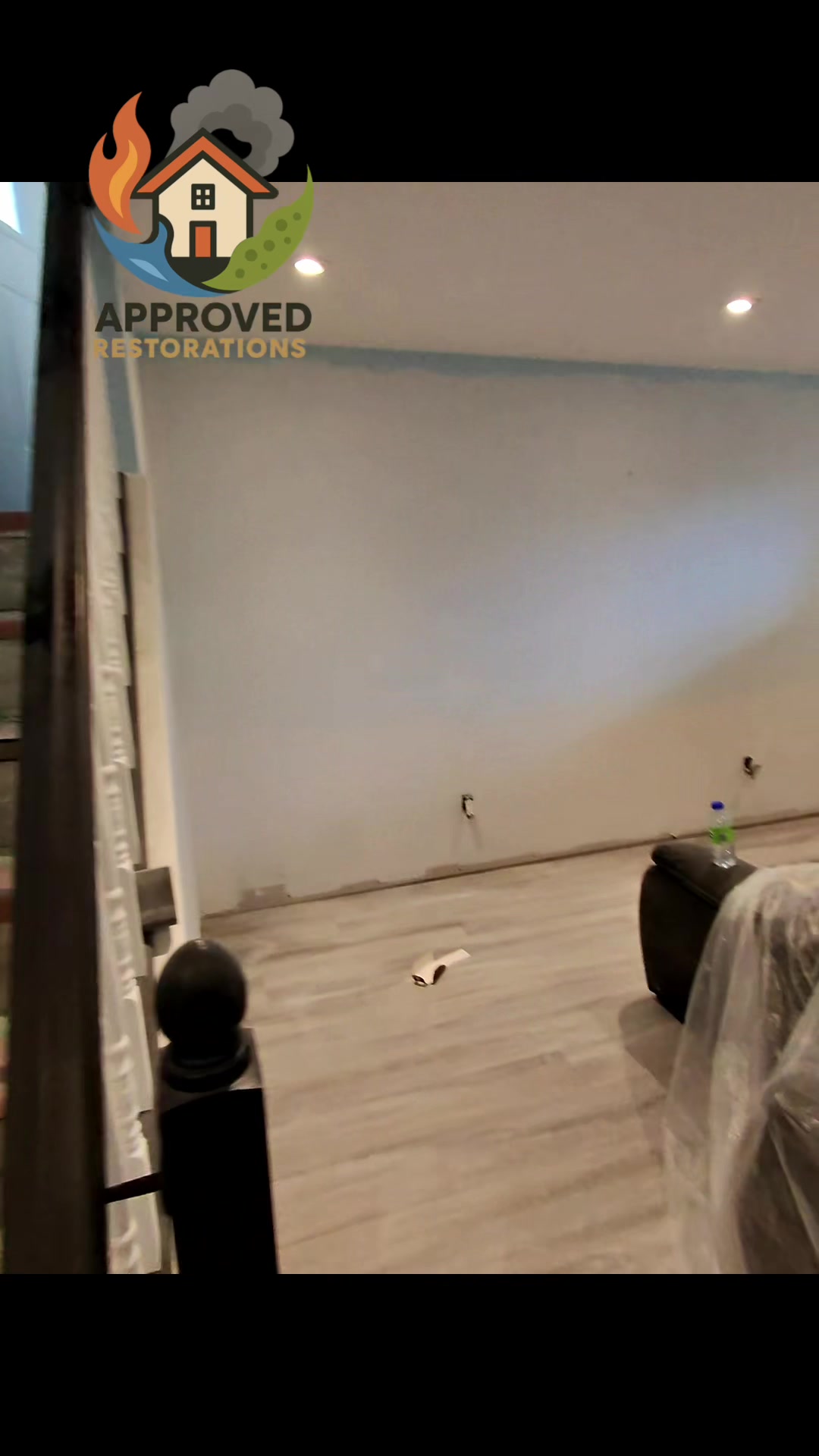 When a sump pump failure allowed water to quickly accumulate across this finished basement, our crew launched into immediate mitigation—tarping the furniture in plastic, tearing out the saturated baseboards, and exposing the lower drywall to track the moisture line before we have to haul out the laminate flooring.