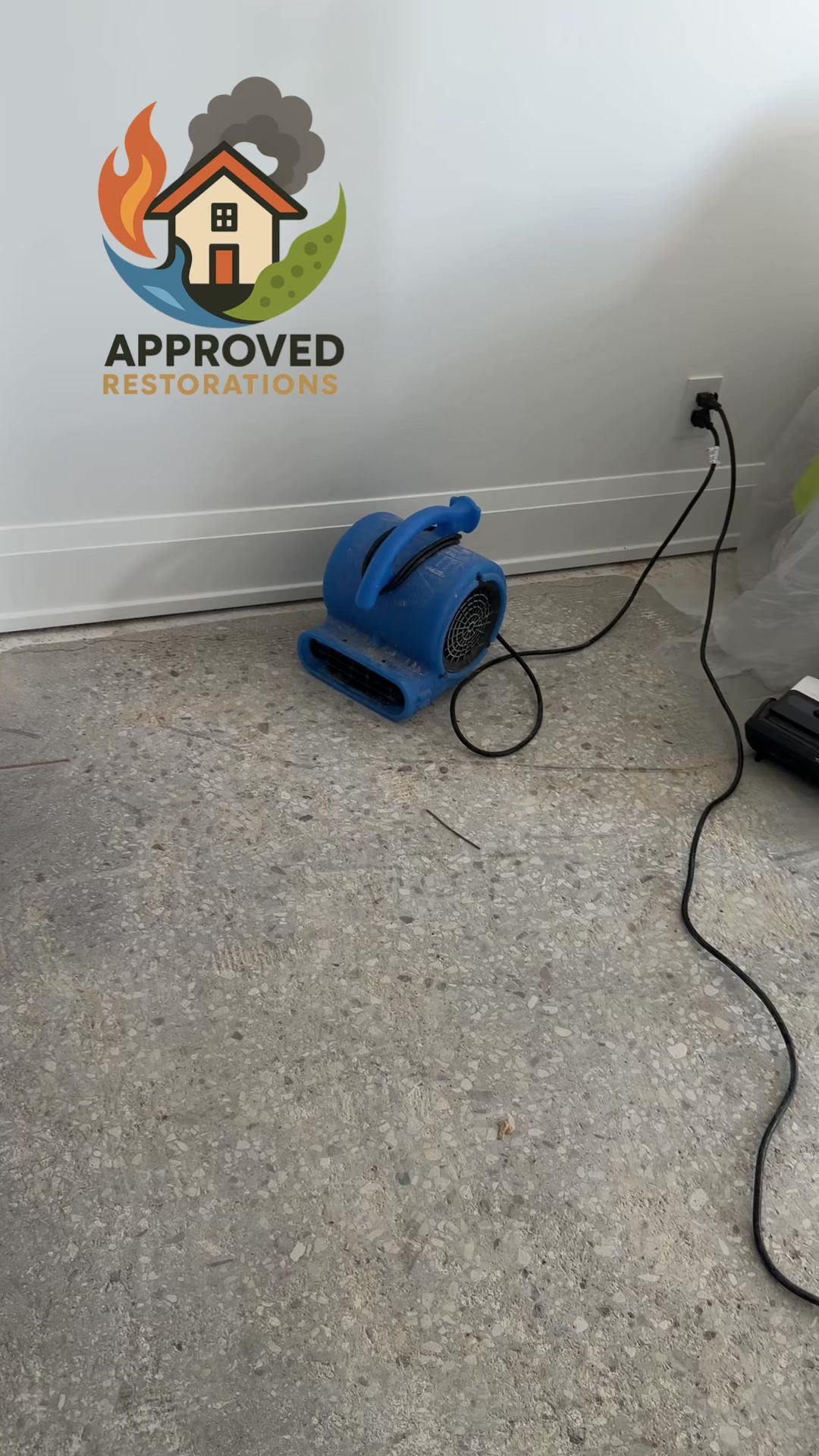 Tackling major water damage in this Toronto condo meant ripping the saturated flooring right down to the bare concrete slab, so our crew has set up plastic containment and fired up commercial air movers along the baseboards to force-dry the footprint before we kick off the final insurance rebuild.