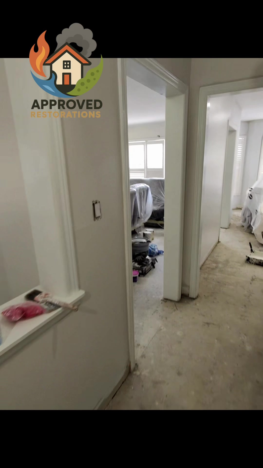 A major flood tore through three floors of this Vaughan home, so our team is pushing hard on the rebuild by rolling fresh paint across the tarped main level while keeping a powder room functional, and our upstairs crew is already setting and grouting brand-new shower tile to get this property fully restored.