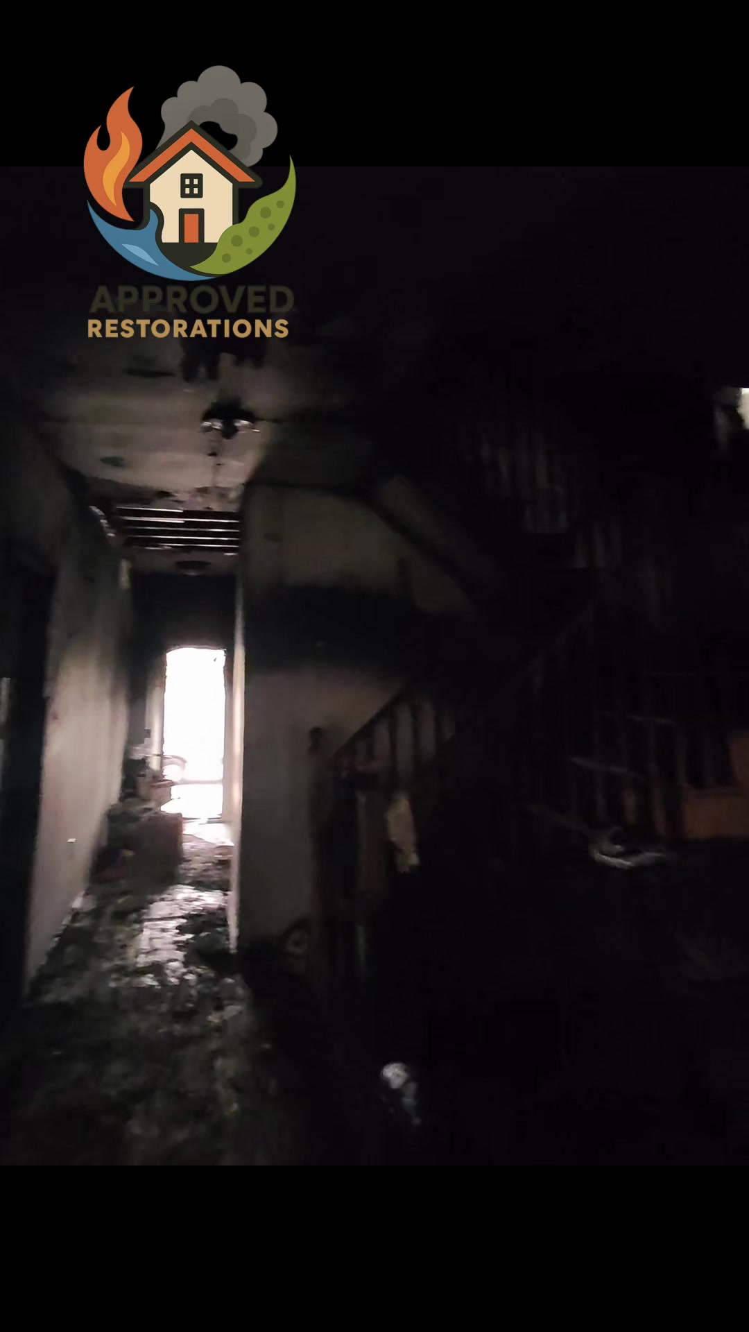 After a devastating house fire ripped through this property and left behind charred framing, heavy soot, and standing water from the fire hoses, our crew is stepping into the pitch-black entryway to assess the major structural damage, preparing to haul out the ruined debris, tear down the compromised ceiling lath, and tackle the severe smoke and water loss before reconstruction can even begin.