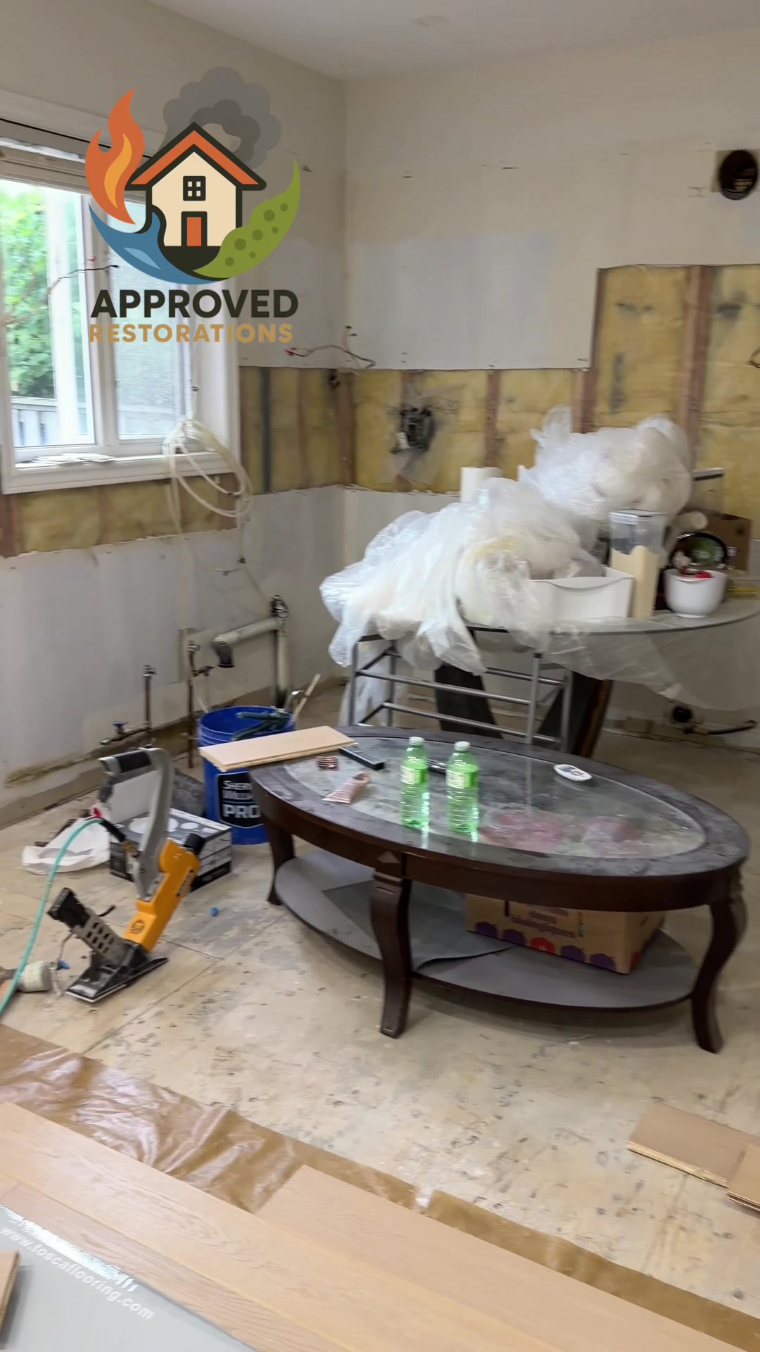 A major flood wiped out three floors of this Vaughan home, so our crew has fully stripped the kitchen and demoed the bathroom—leaving only the sink for now—and we are staging freshly delivered stacks of tile to continue laying the main level flooring before tackling the upstairs rebuild.